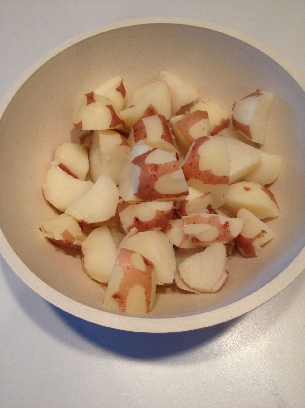 Drain potatoes and add to large bowl.