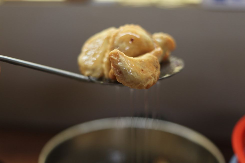 Drain some of the syrup from the parcels.