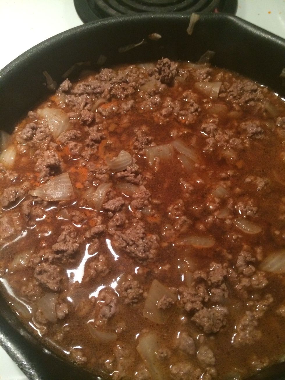 Drain the beef and add the water, chili pepper, and cumin in a separate bowl. Mix until dissolved then add to drained beef and onions. Simmer and stir occasionally for 10-15 minutes.