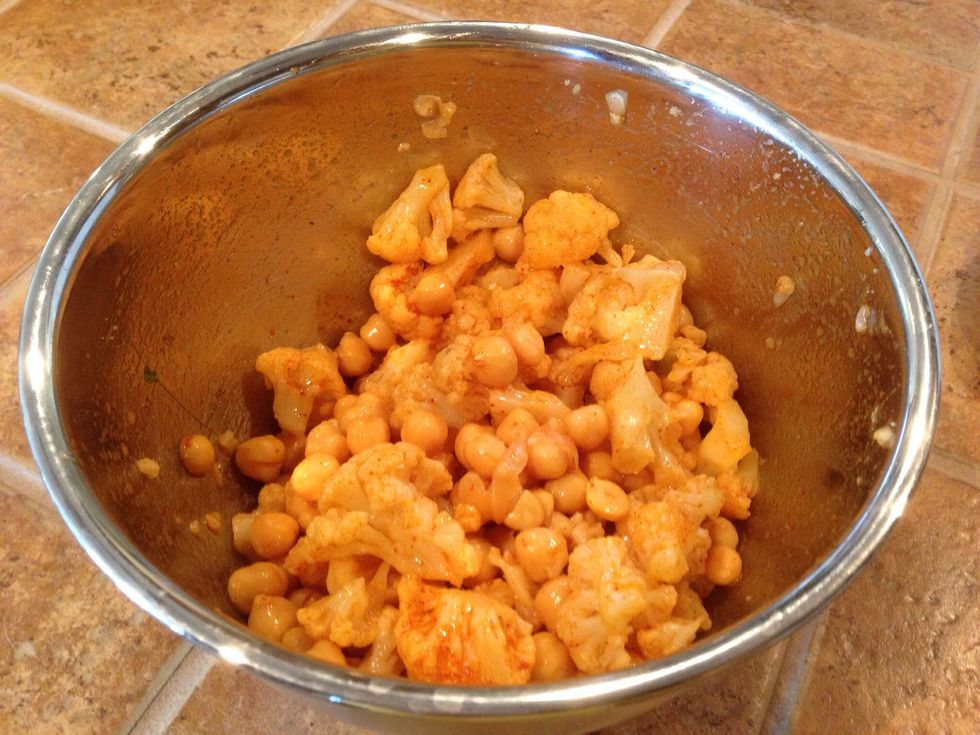 Drain the can of chickpeas and toss together 2 tbls taco seasoning, 1/2 bag chopped cauliflower or more, the chickpeas and 1 tbls olive oil.