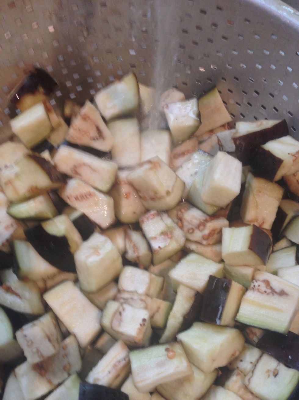 Drain the eggplants out of the salty water and wash it to get rid of salt.