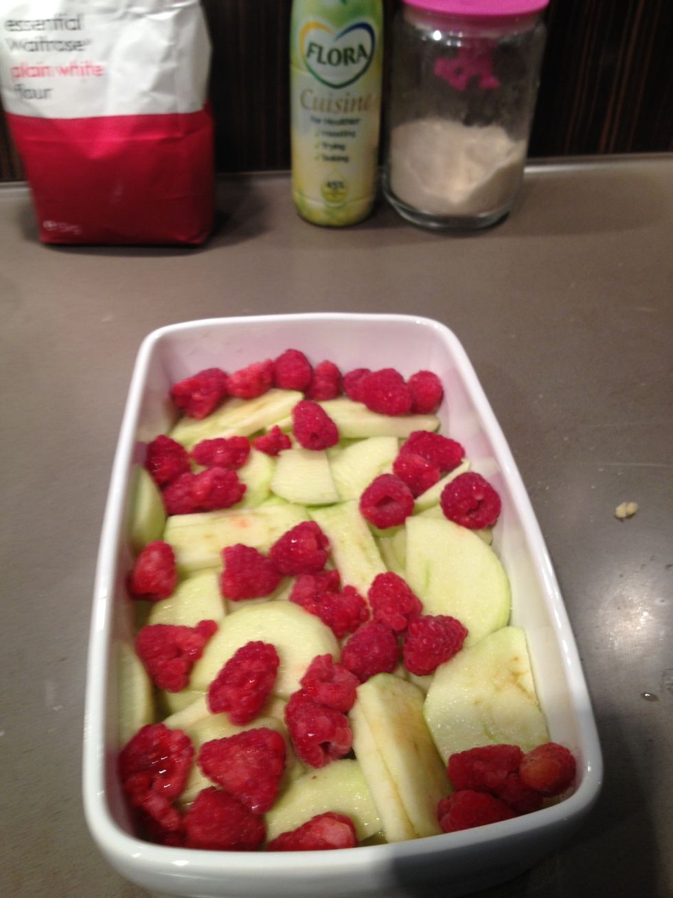 Drain the excess lemon juice from the apples (or transfer the apples into individual serving dishes), add some red fruit...