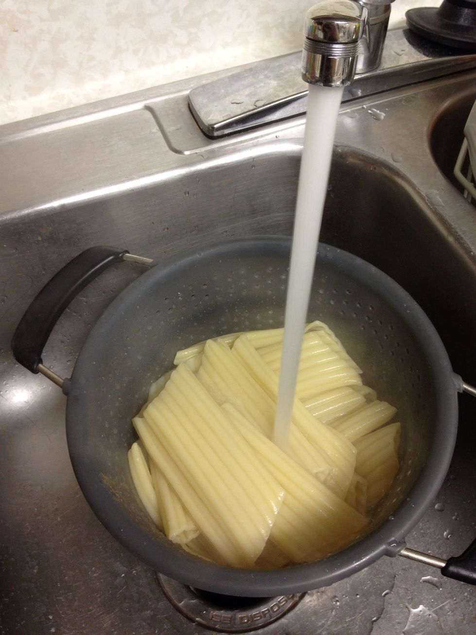 Drain the noodles and rinse with cold water so you won't burn your hands when stuffing them.