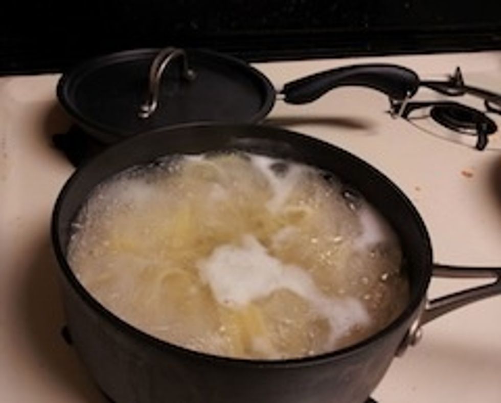 Drain the pasta, reserving 1/2 cup cooking water, and return it to the pot.