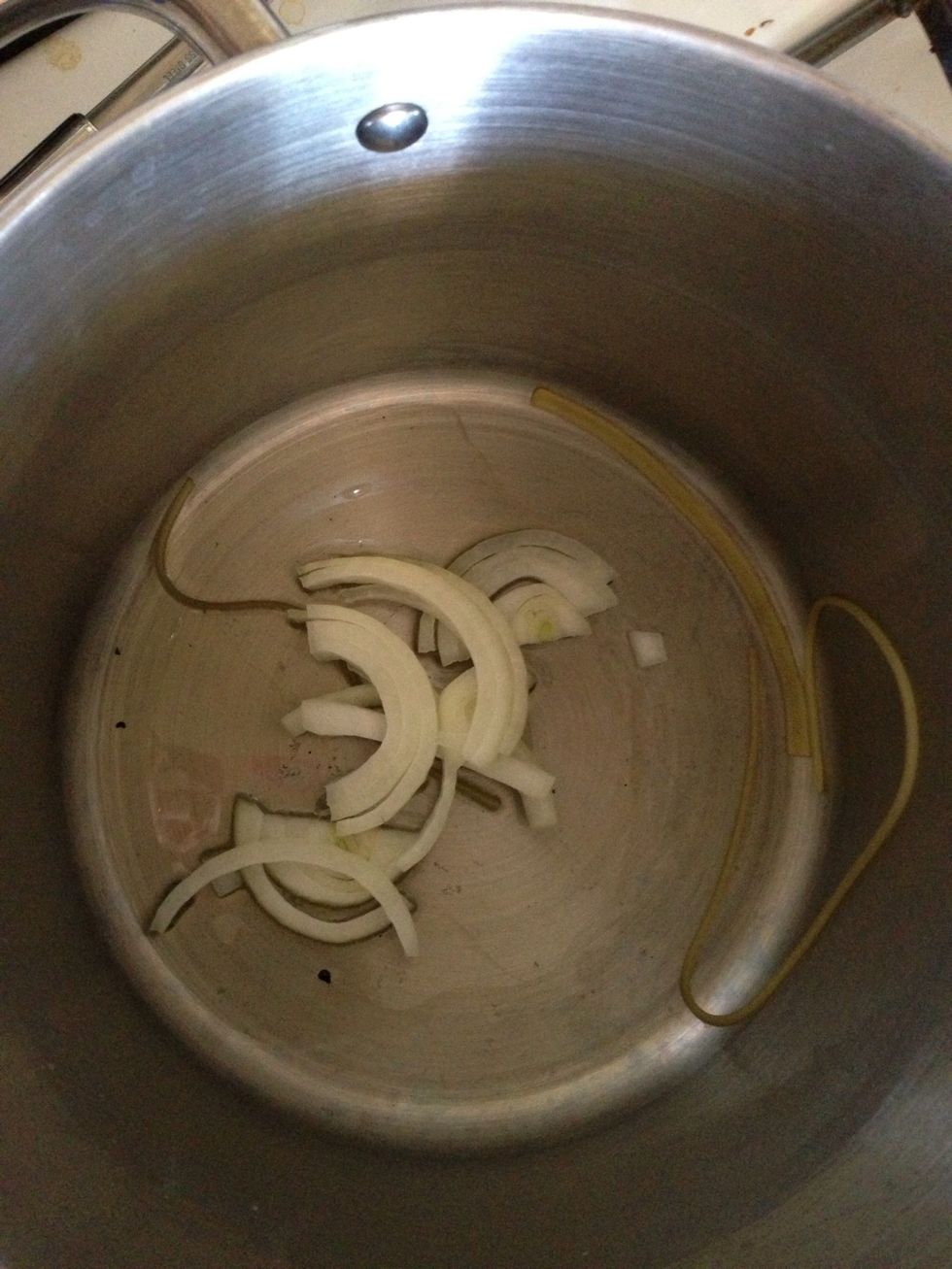 Drain the pasta. While it drains, add 2 tbs of oil to the same pot and add your sliced onion. Stir for about 3 minutes. Then turn off the stove.