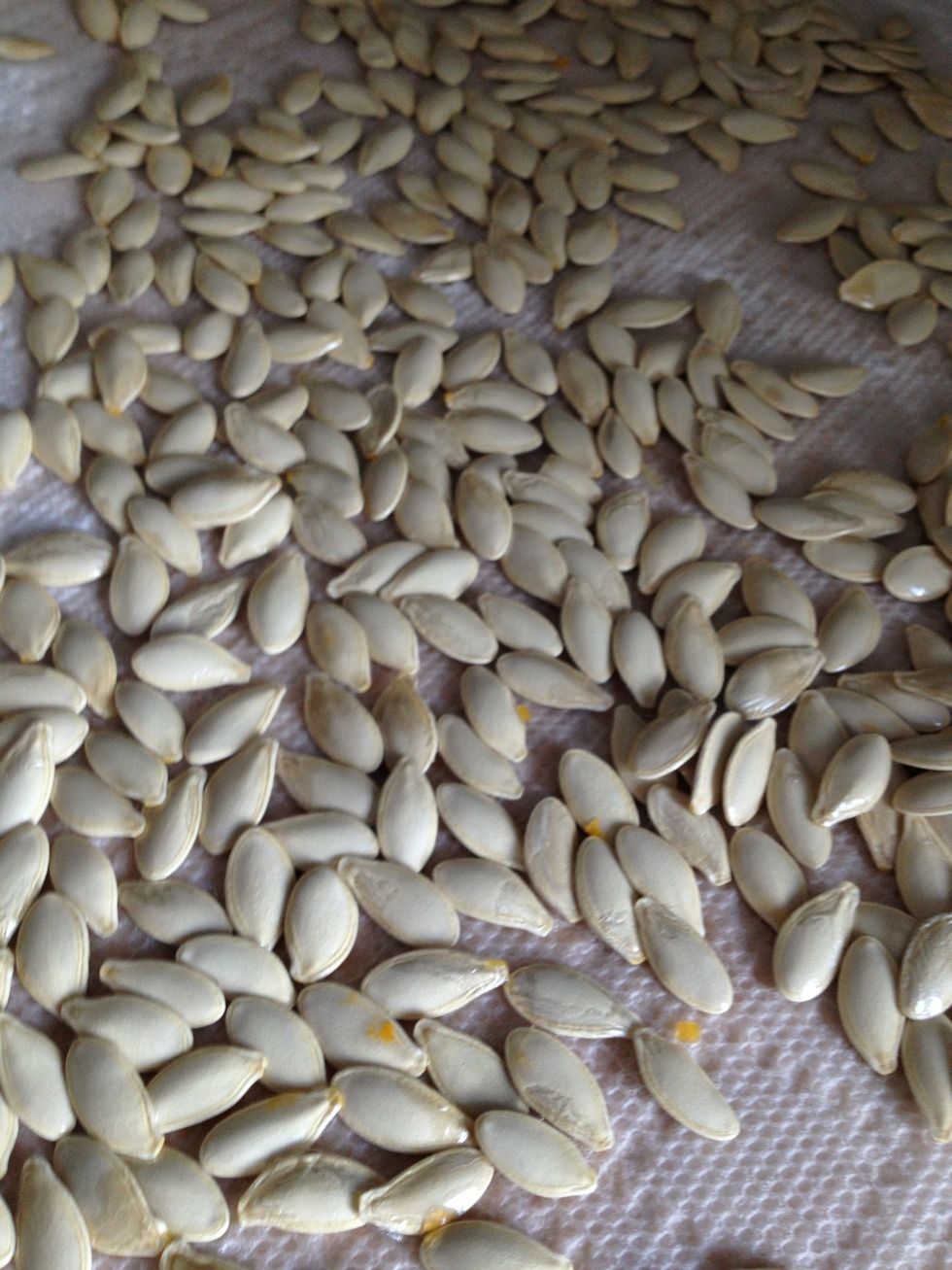 Drain the pumpkin seeds well and pour onto paper towel to dry them even more.