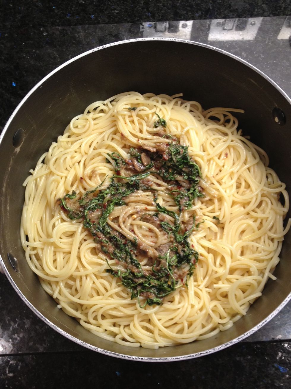 Drain the spaghetti once cooked and put back in the pan. Then empty all your warmed up sauce on top and mix well so all the spaghetti is coated.