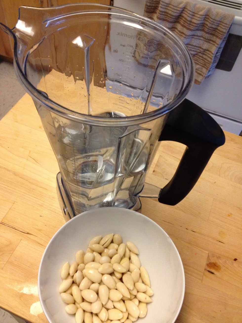 Drain the water from the almonds. Pour 4 cups of filtered water into the blender.