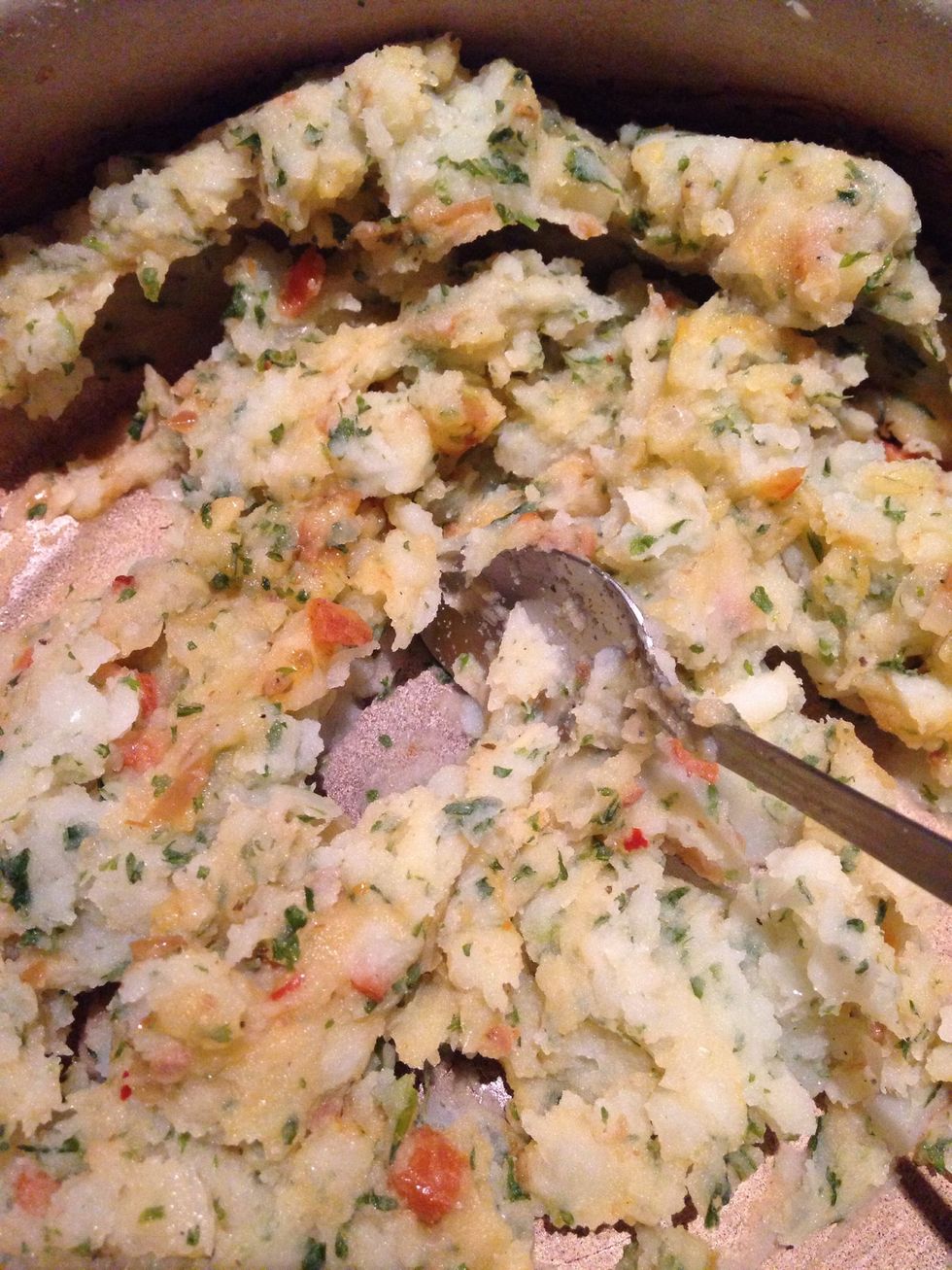 Drain the water off the other potato mix and mash roughly.