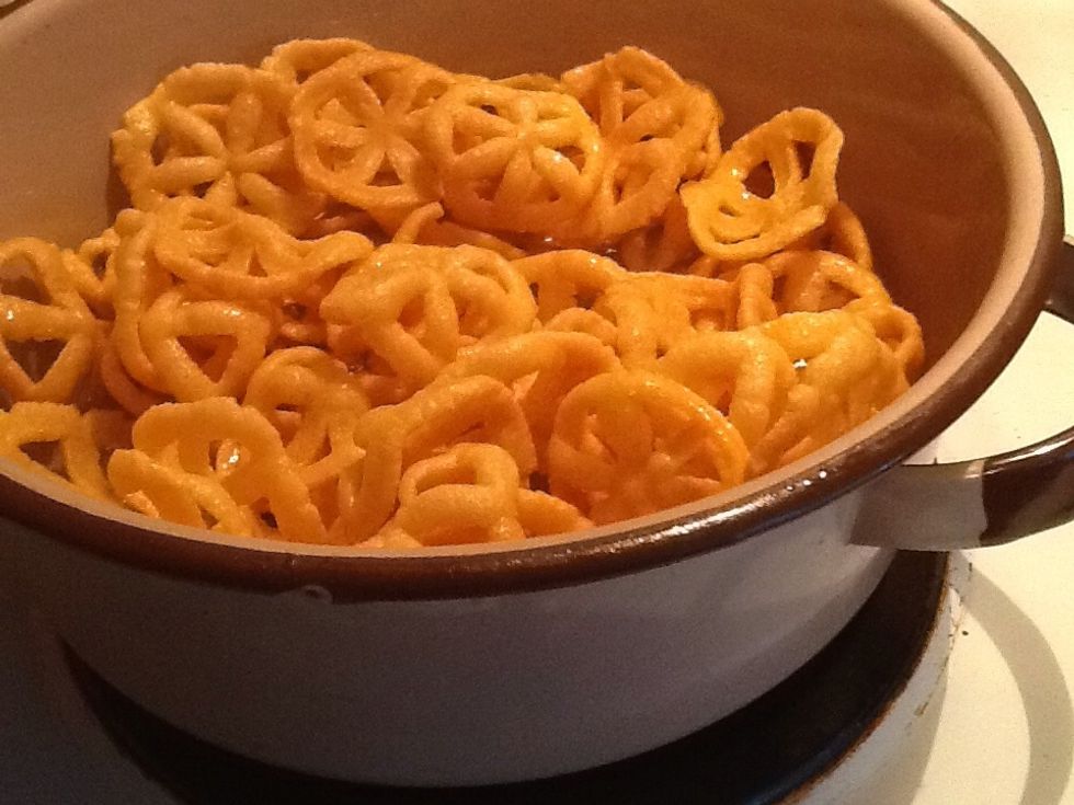 Drain them from your oil place them in a bowel until all done making them then