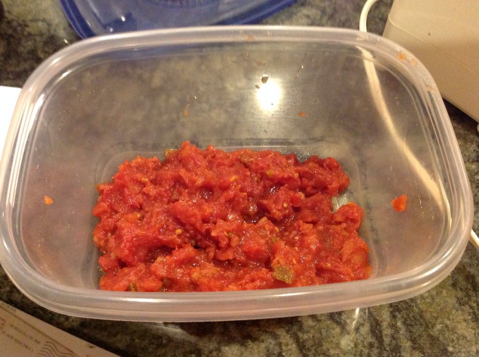 Drain two 14-1/2 oz. cans of stewed tomatoes and mince.