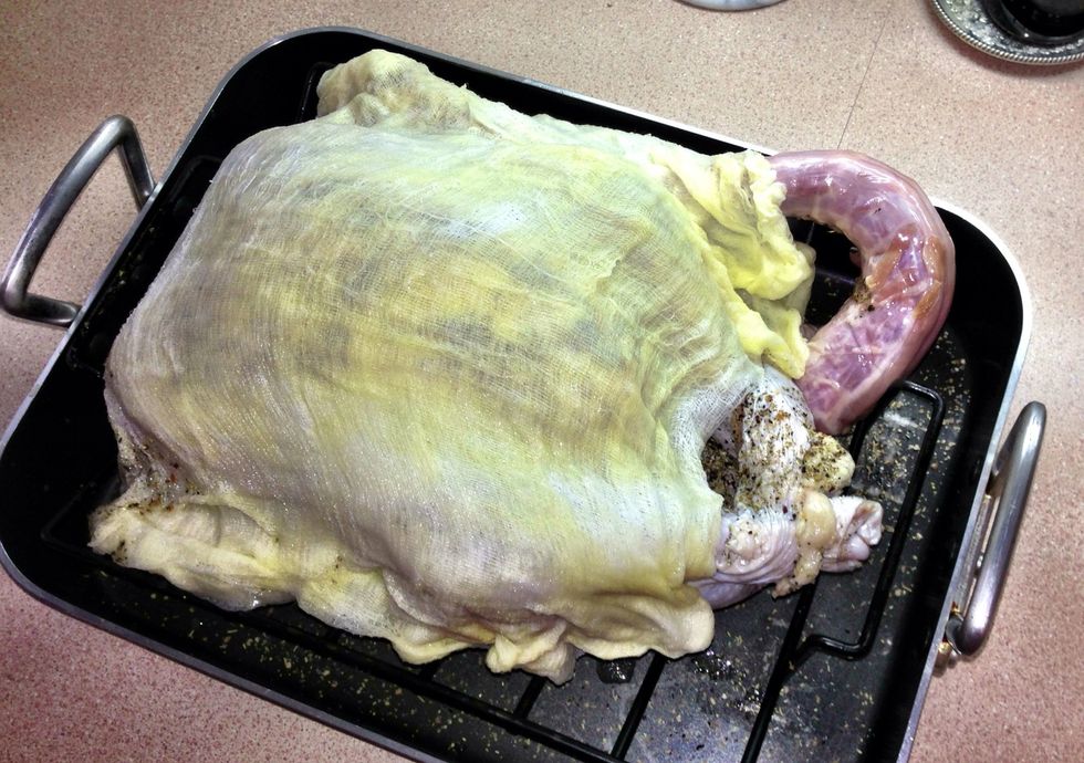 Drape the bird with the wine/ butter soaked cheesecloth. Put into a 450 degree oven for 30 minutes.
