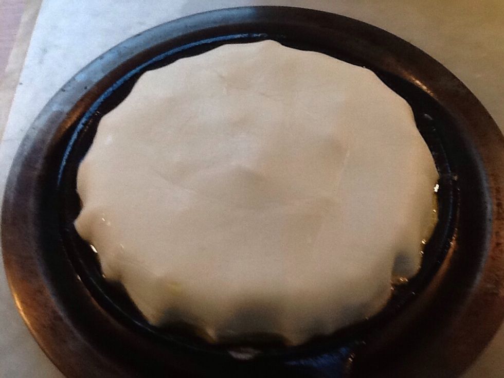 Drape the pastry over the apples and tuck in the edges. Then place the pan in the oven for about 20 minutes or until the pastry and apples have finished cooking