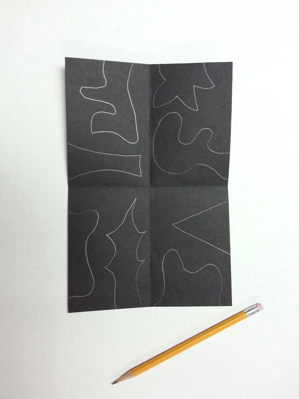 Draw 2 interesting shapes (geometric or freeform) in each of the four sections. Draw them along the edge of the paper. Each shape must start and end on the same edge.