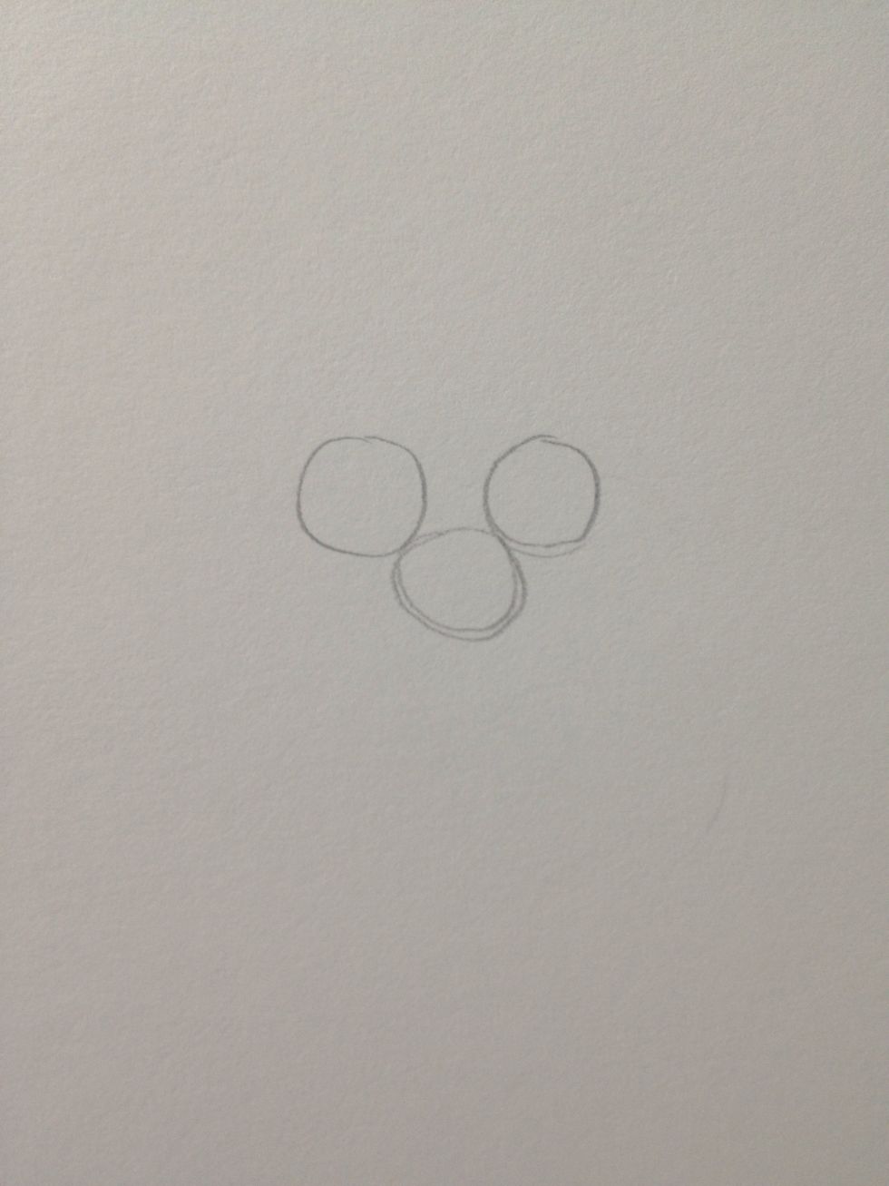 Draw 3 circles like this. They don't have to be perfect