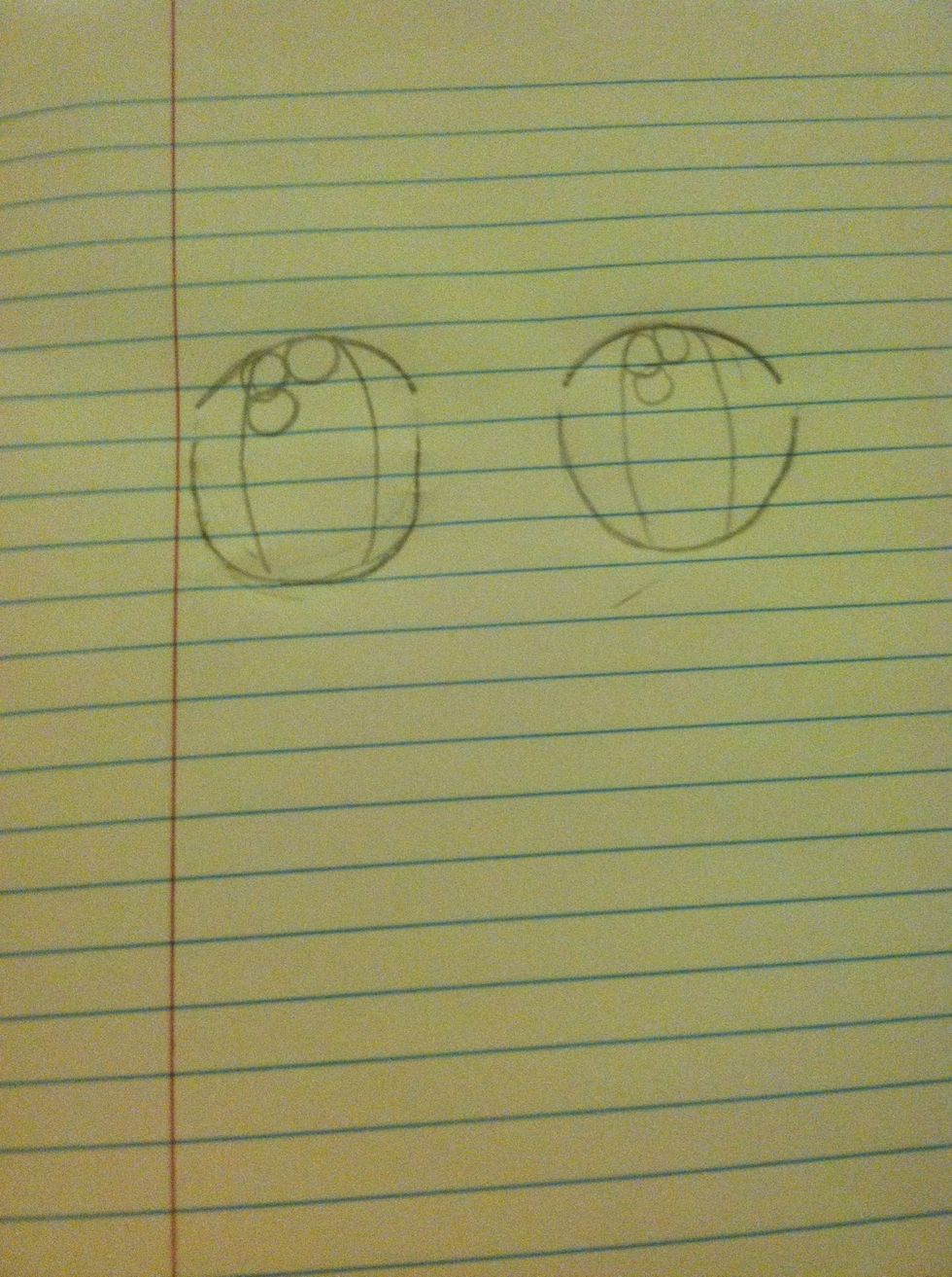 Draw 3 small bubbly circles in each top left corner of the pupil.