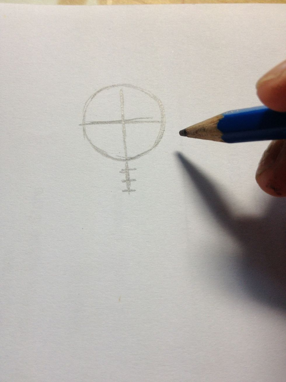 Draw 3 small lines at the below of the circle on the vertical line shown above