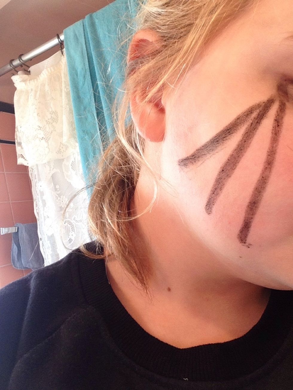 Draw 4 (I know I drew 3) lines coming out of the point you made. Make curved lines to make it look like a creepy spiderweb.