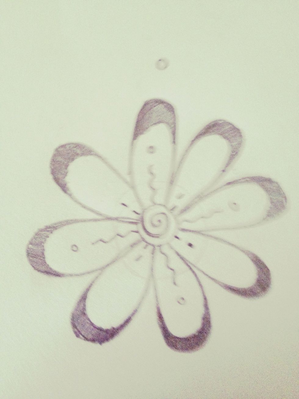 Draw a circle above the petals, about this far up.