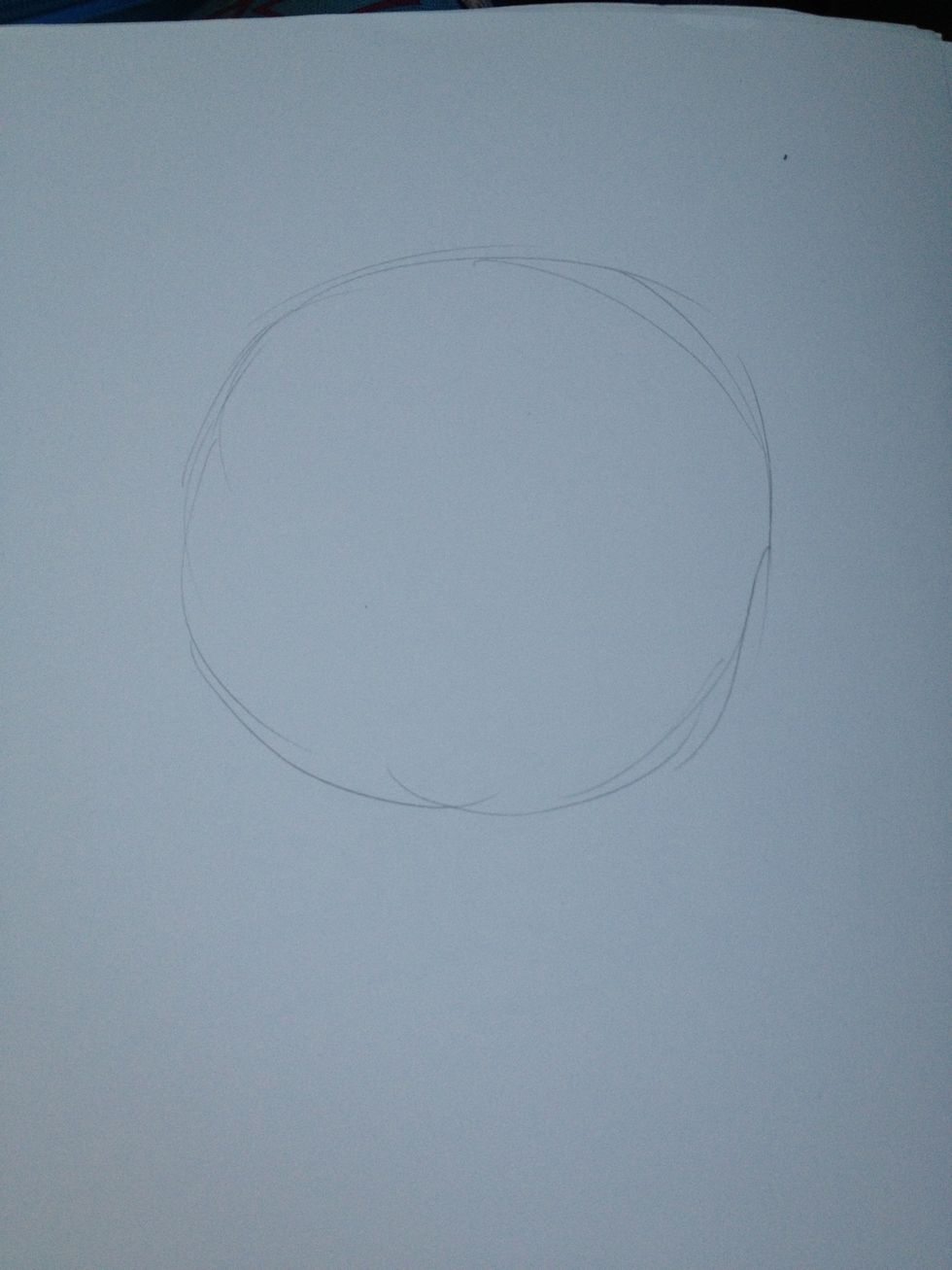 Draw a circle. Draw it lightly, otherwise you won't be able to erase it later. Make sure it almost fills the paper.
