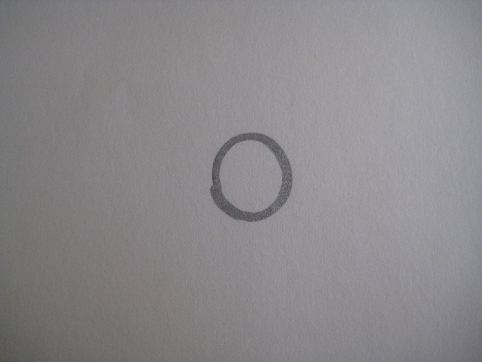 Draw a circle for the head.