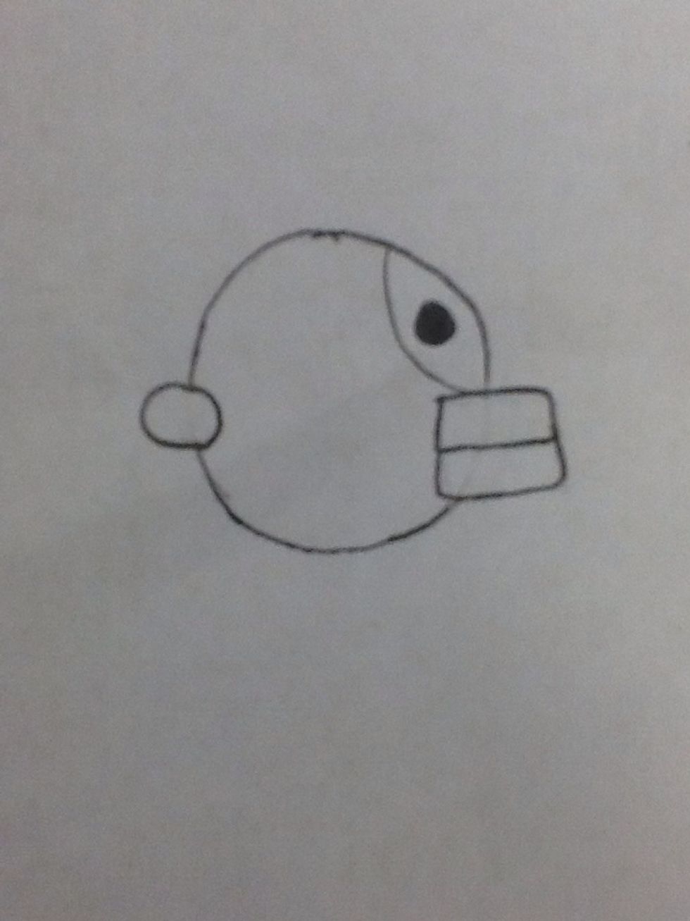 Draw a colored-in circle in the top section for the eye. Now you're ready to start coloring him in!