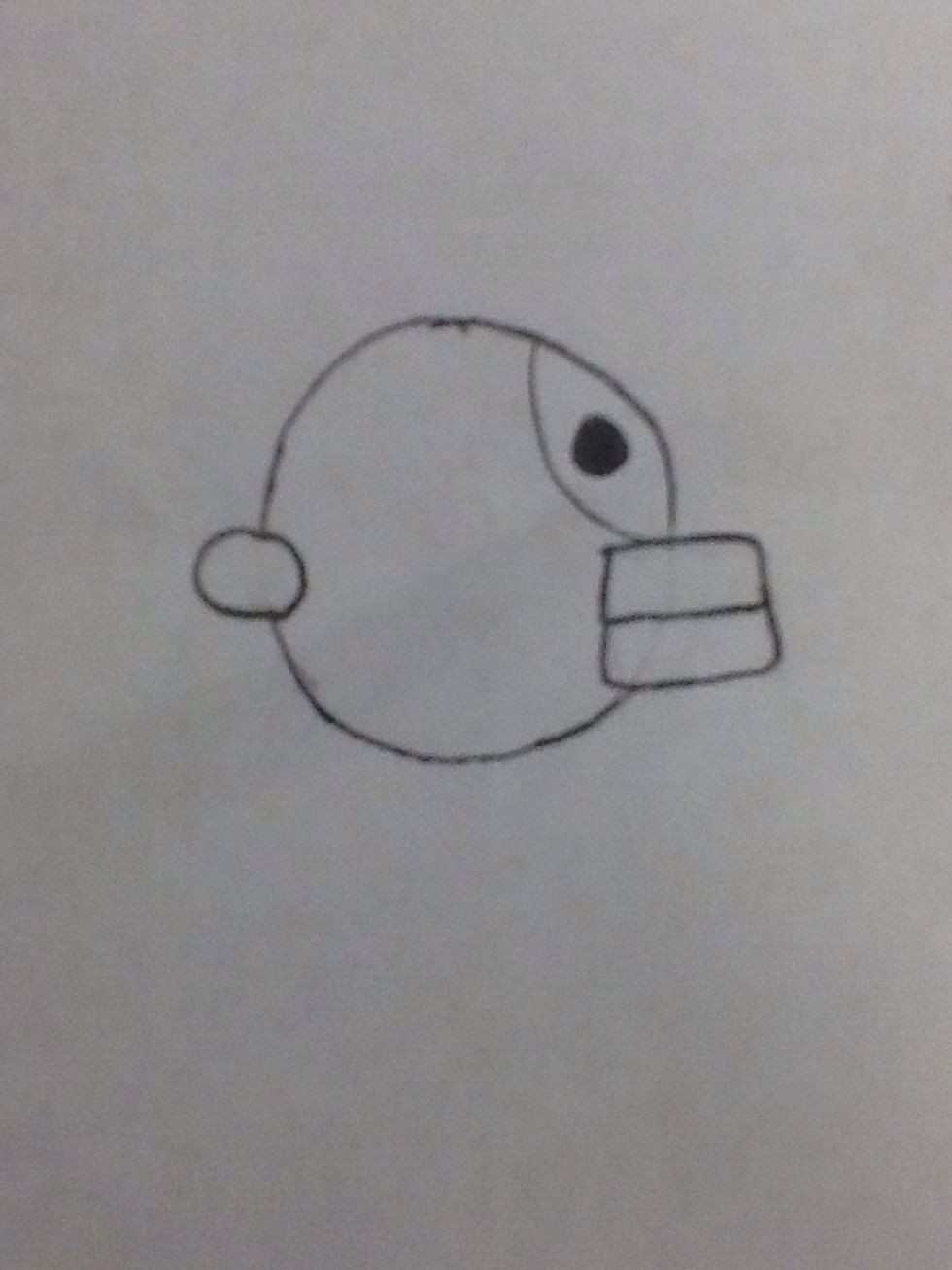 Draw a colored in circle in the top section for the eye. Now your ready to start coloring him in.