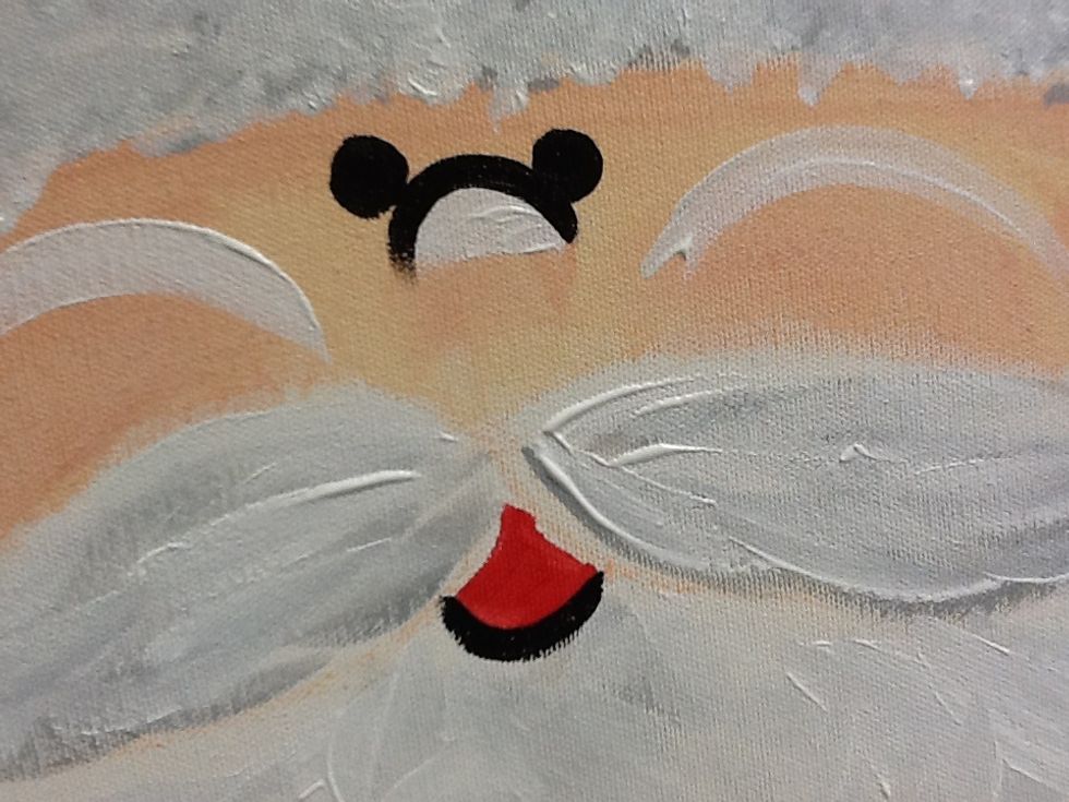 Draw a curve line for the top of the nose, two dots for eyes, and underline the mount.