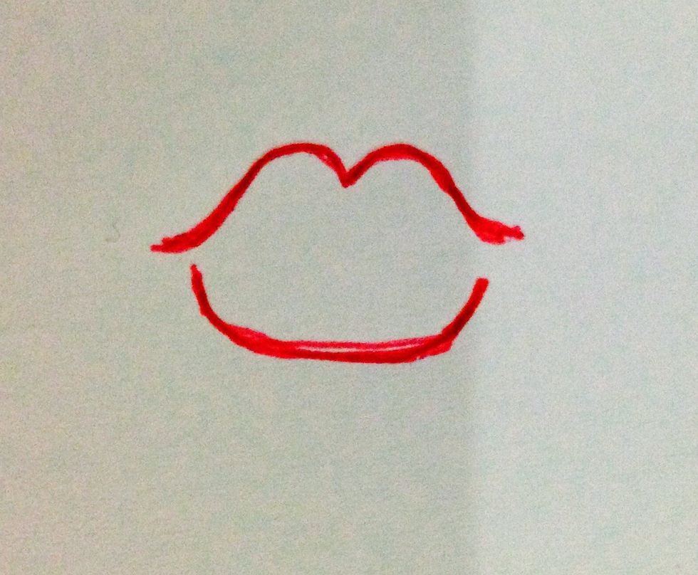 Draw a curved line for the bottom lip.