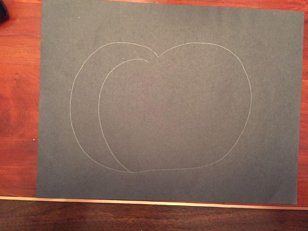Draw a curved line inside your pumpkin on the left.