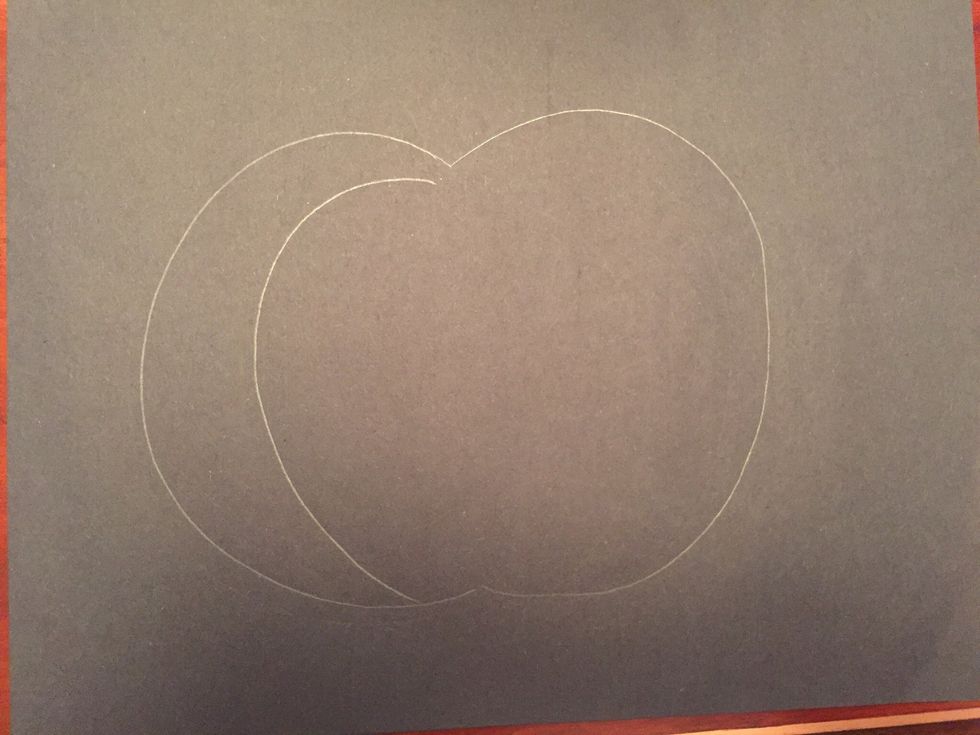 Draw a curved line inside your pumpkin.