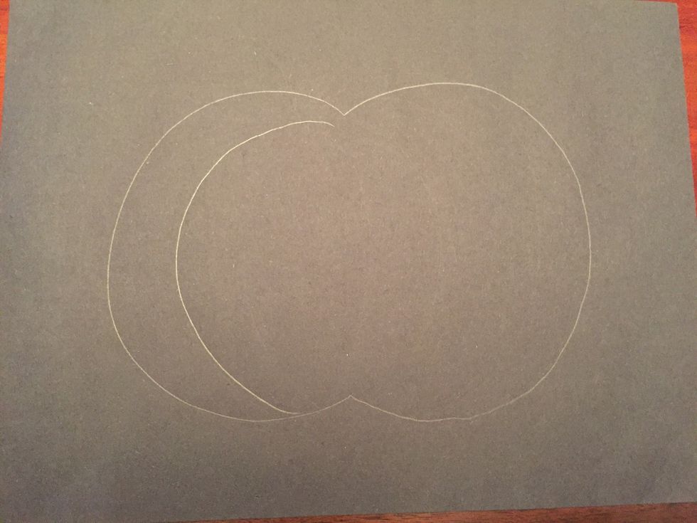 Draw a curved line inside your pumpkin.