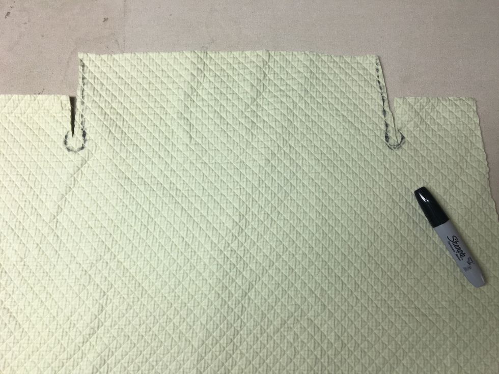 Draw a cutting line to square up the sides of the back flap/drop if necessary and where you want to trim out a circle at the end of the cuts so it will fit around your legs.