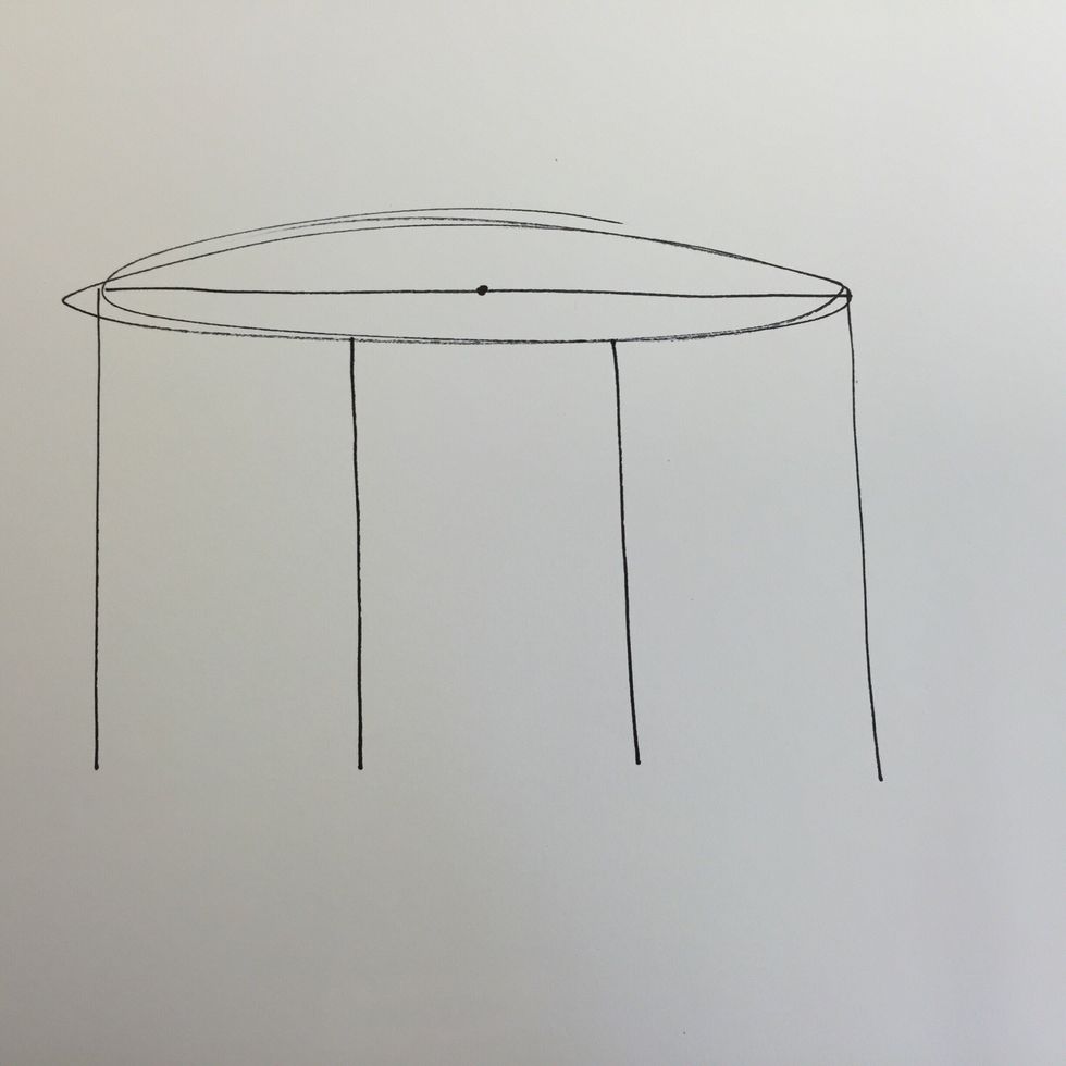 Draw a dot to indicate the center of the oval. Draw two vertical lines on either side.