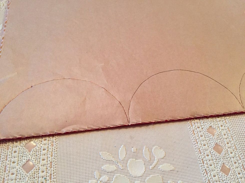 Draw a half circle onto red or green felt. Cut out all pieces. You will need one half circle per Mickey.