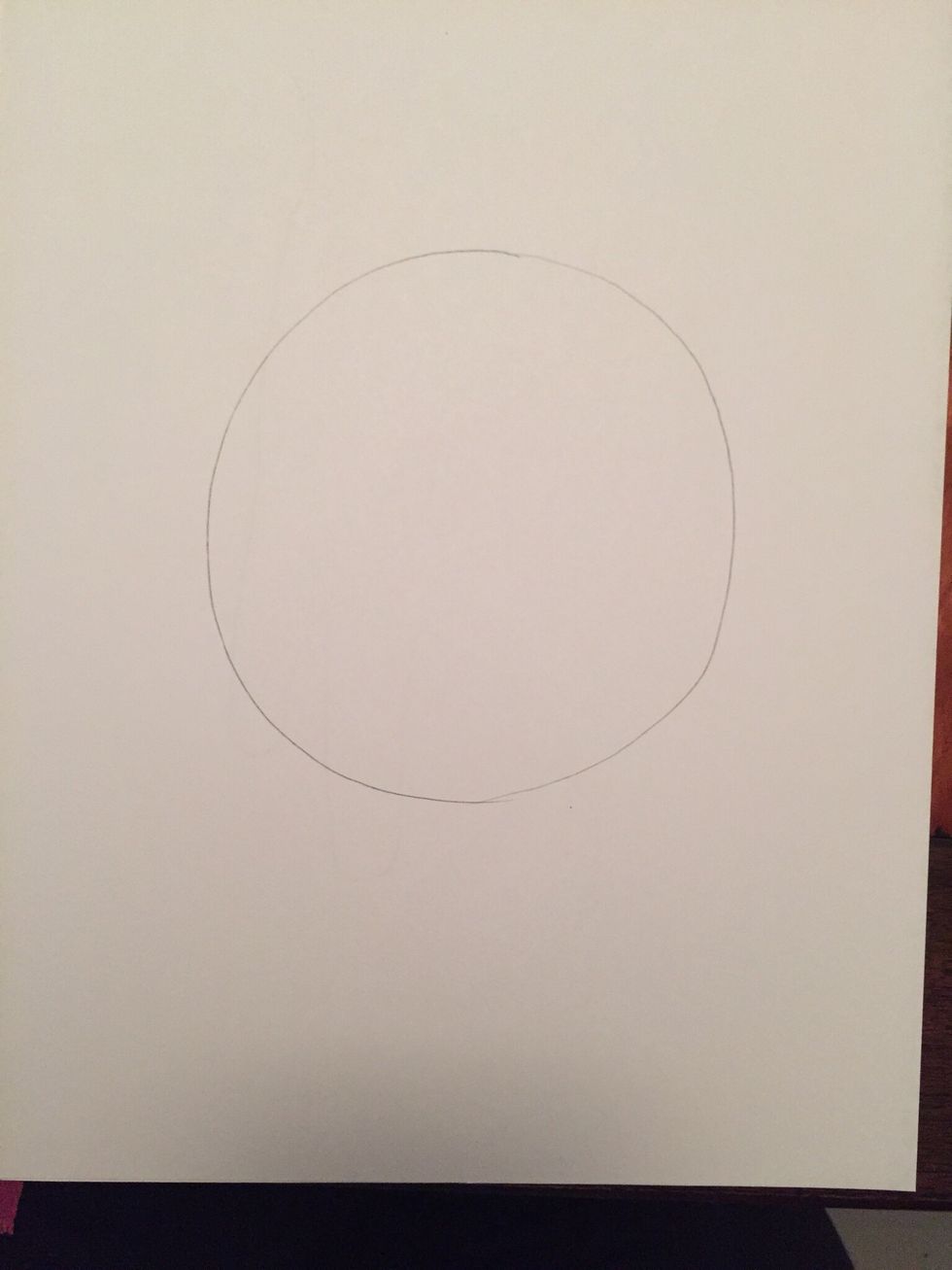 Draw a large circle lightly in the middle of your paper.