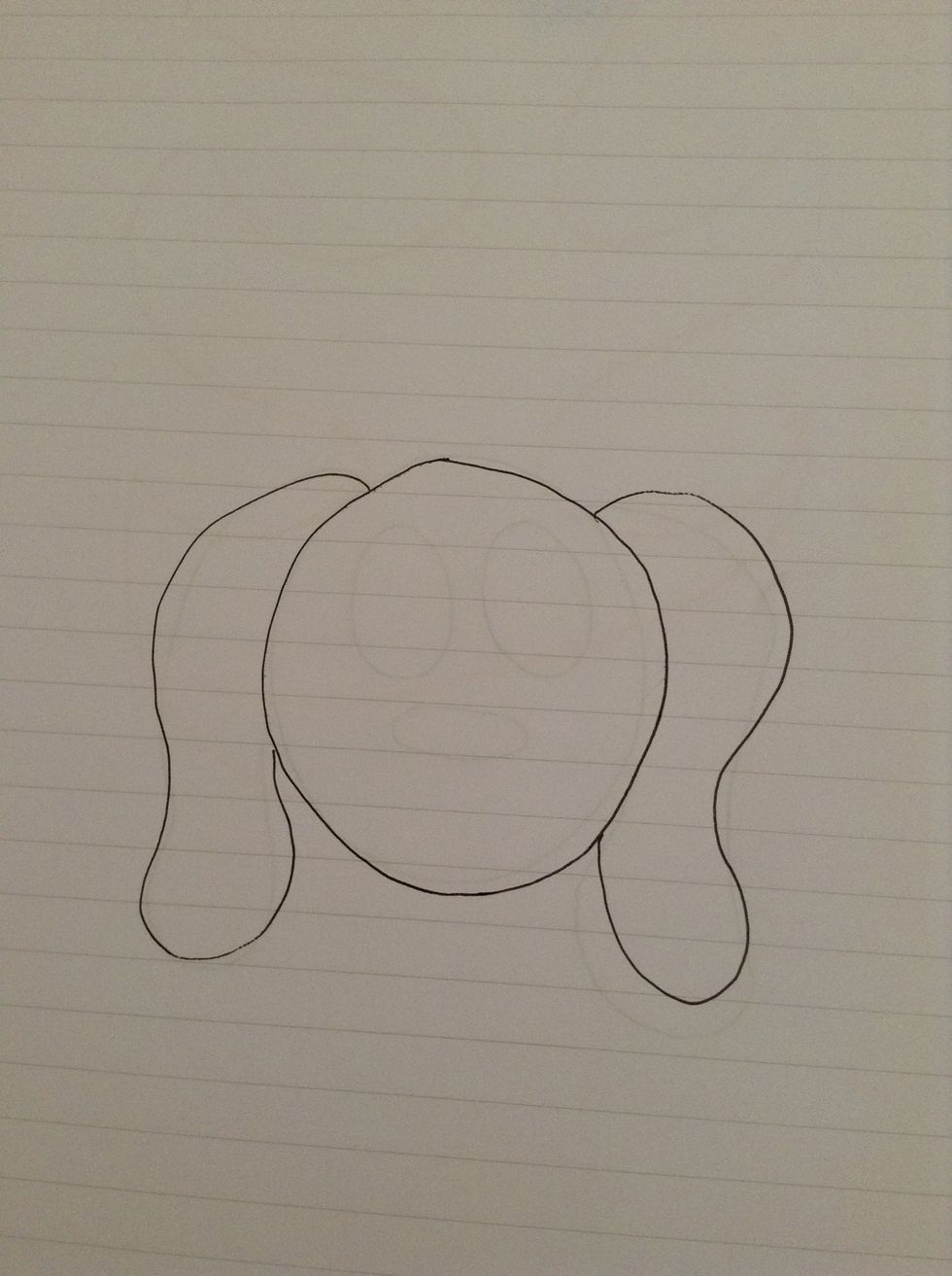 Draw a largish circle with two floppy ears.