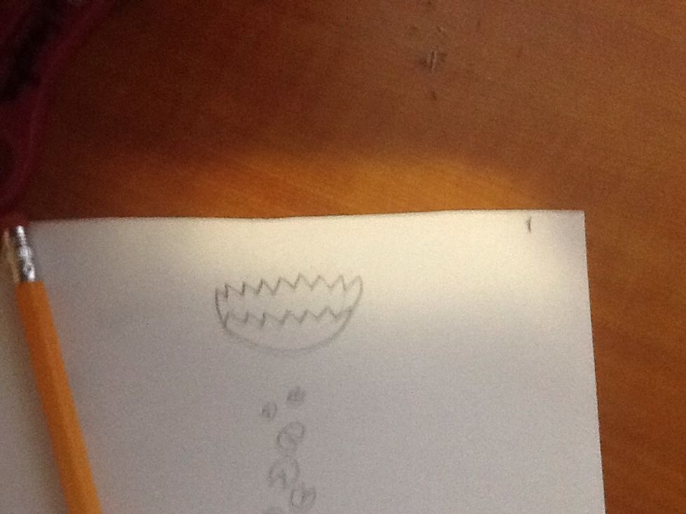 Draw a lily pad flower at the top of the smaller lily pads and leave some room between them for the big lily pad.