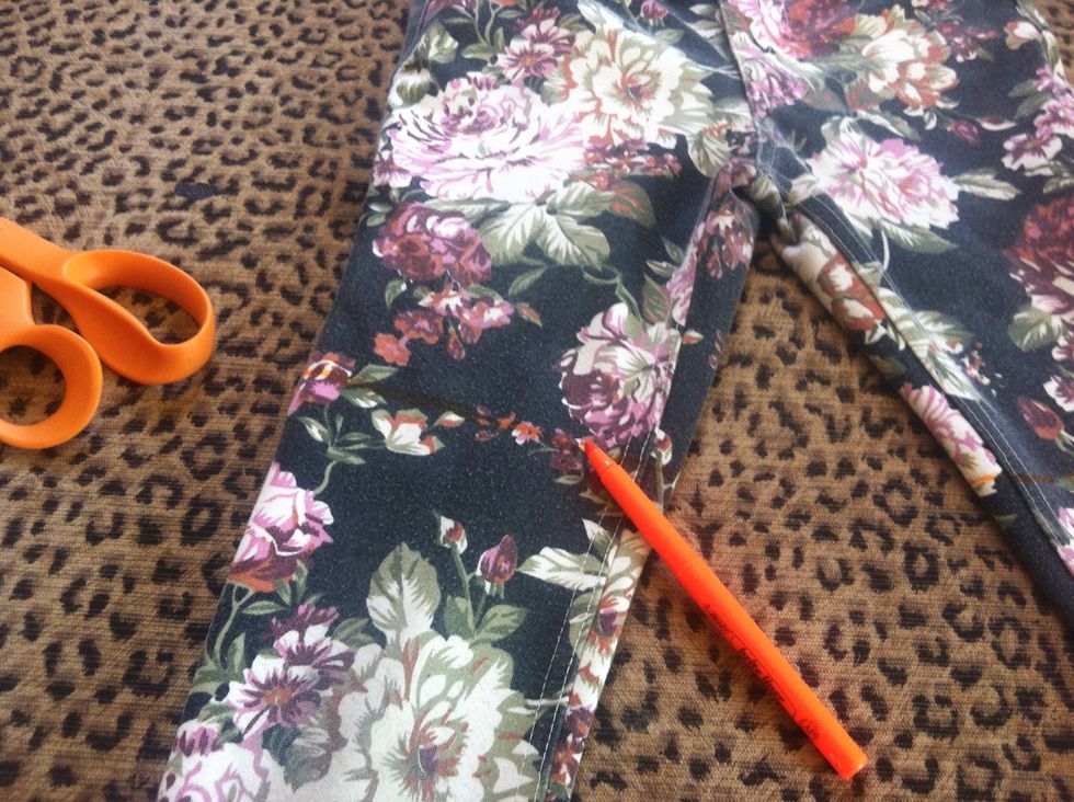 Draw a line a little  bit lower than you want your shorts to be.