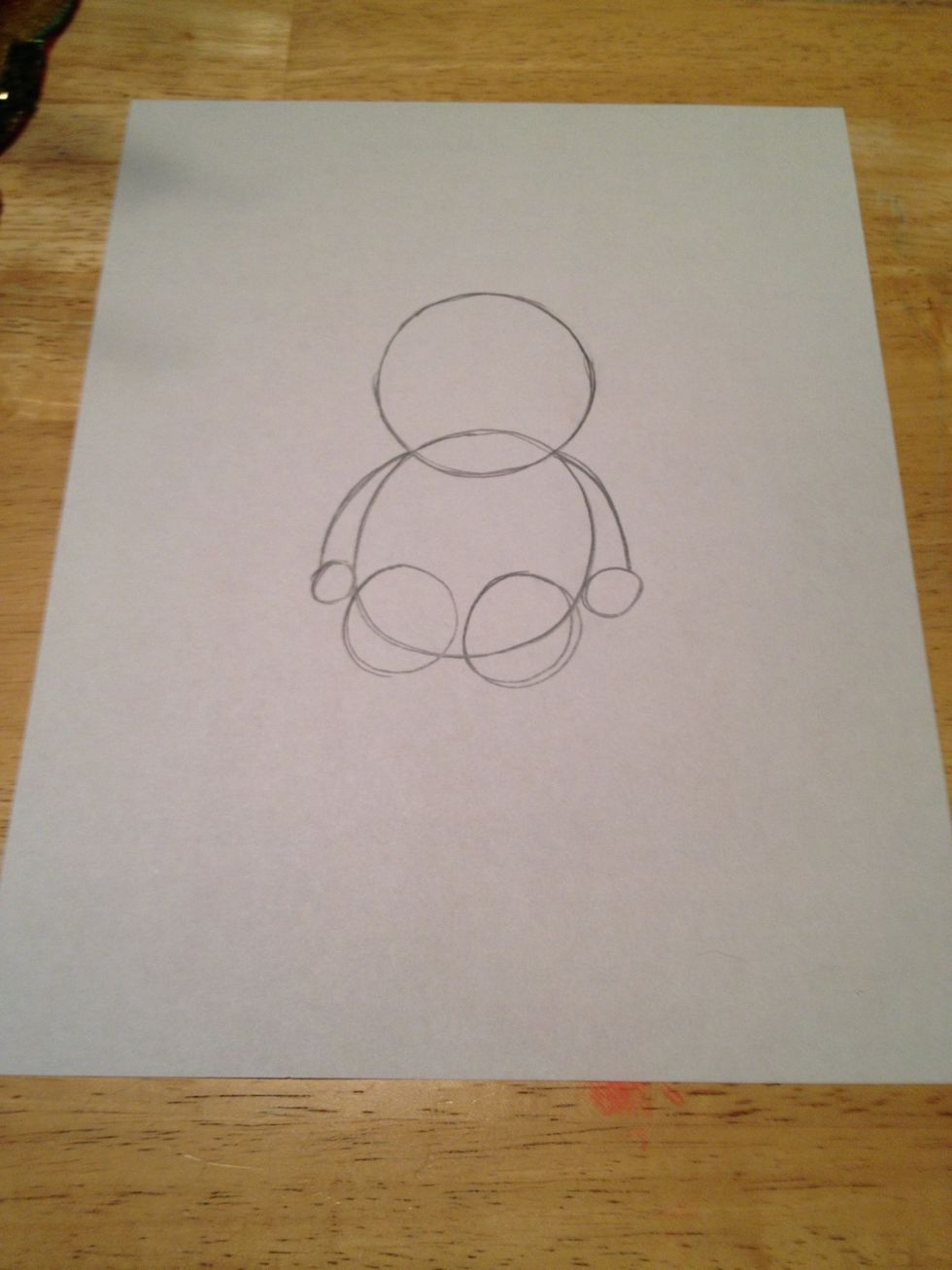 Draw a line connecting the arms to the hand circles to form wings.