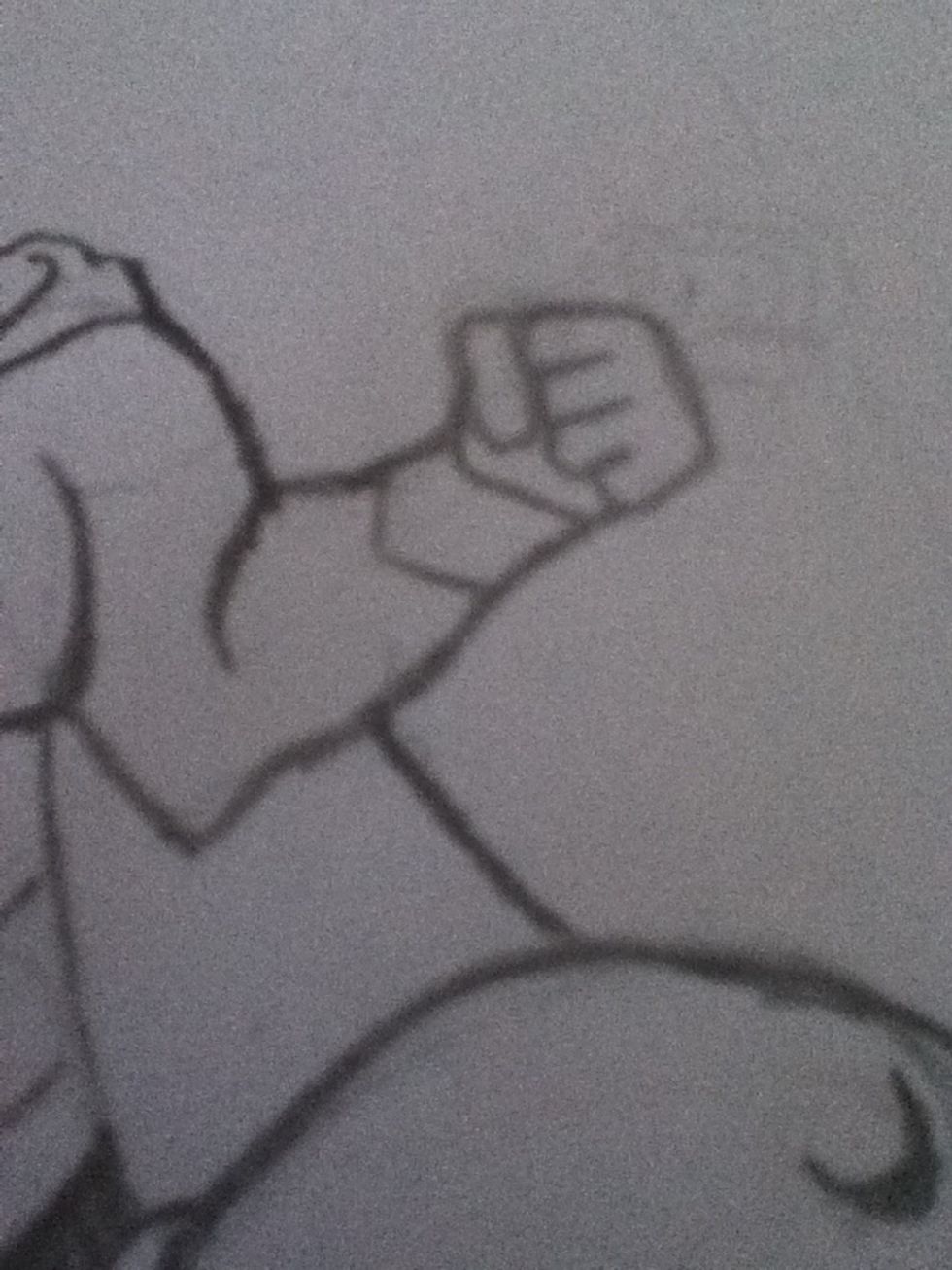 Draw a line from the arm to the knee to complete the cape