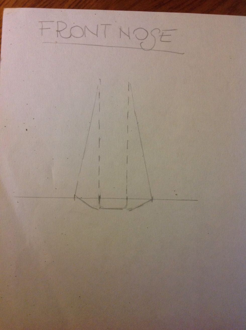 Draw a line on each side. Join the top of the vertical lines with the sides of the nose. And join with other line, the sides of the nose with the base in the middle space.