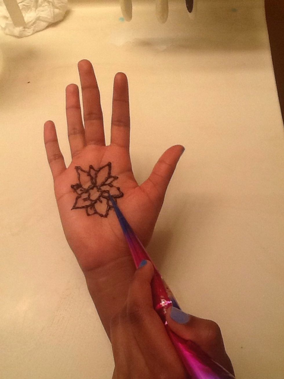 Draw a line starting at the circle going up one third of the way up the petal.