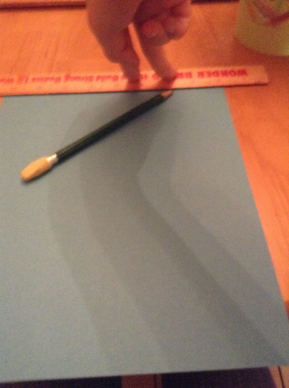 Draw a line the thickness of the ruler on both sides