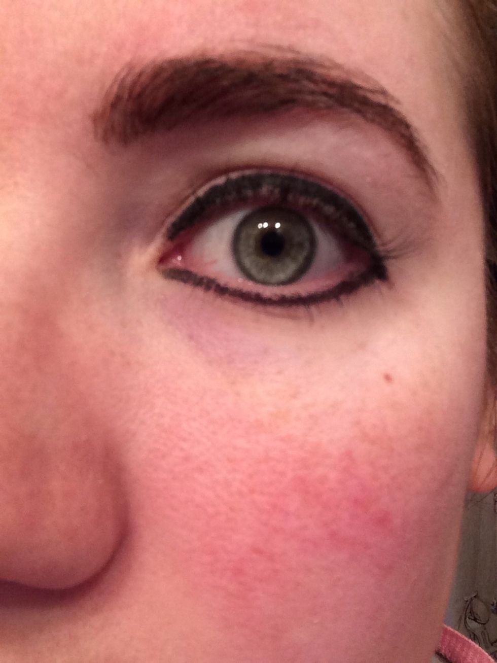 Draw a line with black eyeliner all the way around your eye, concentrating on the lash line of the upper lid.