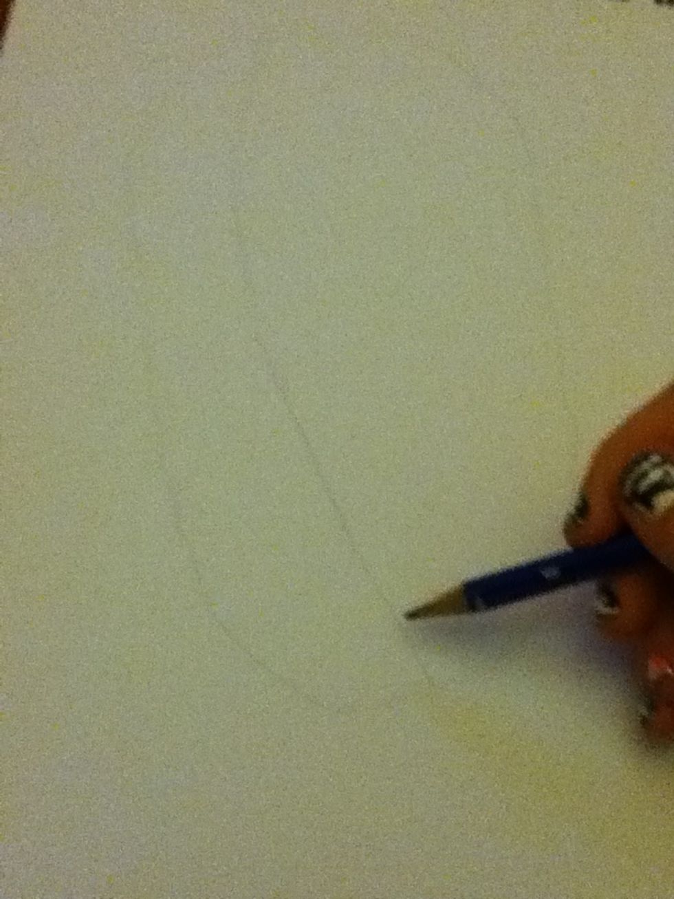 Draw a long line from the top of the oval to the bottom a few centimeters in