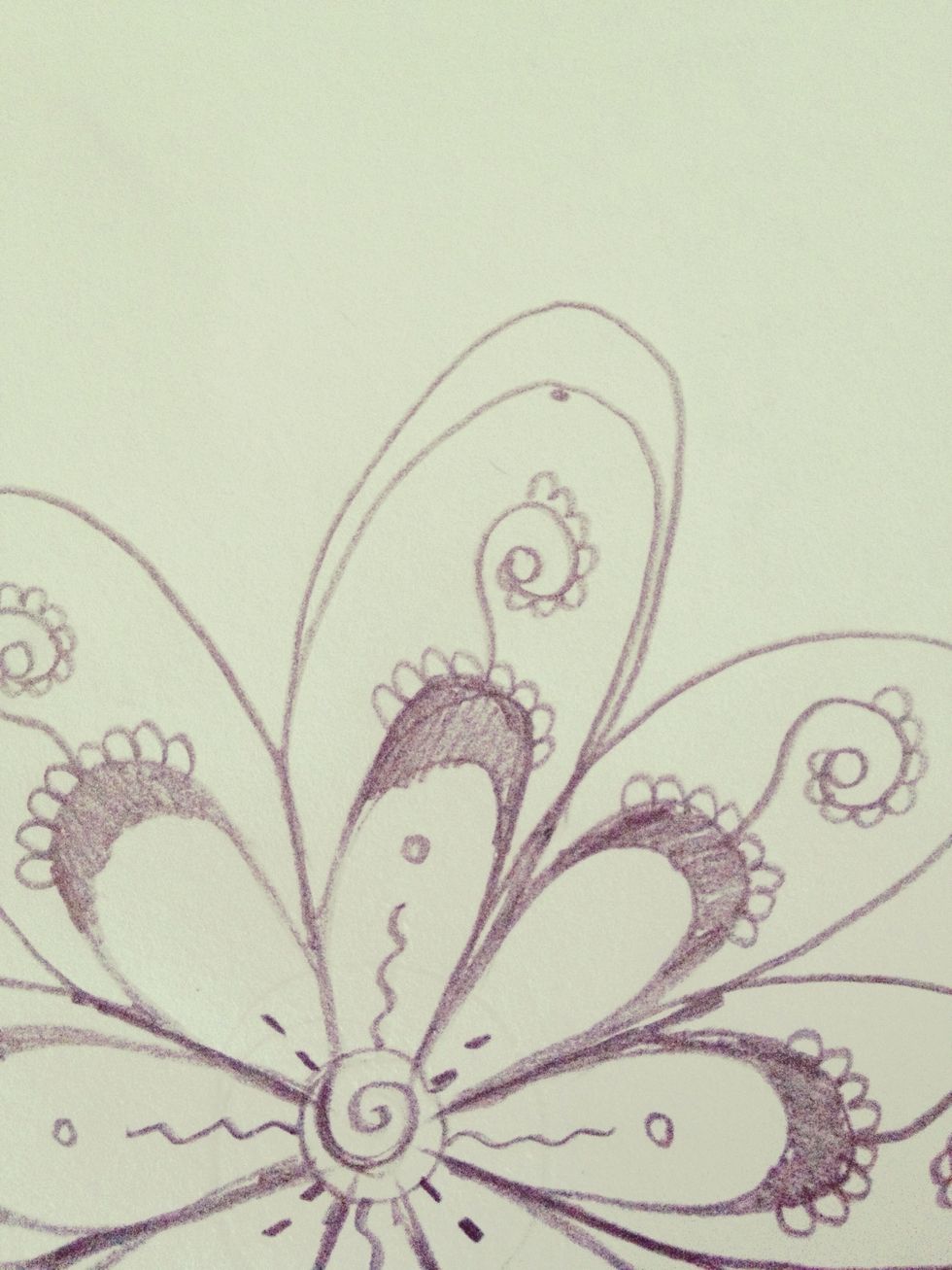 Draw a loop above the second petal like this.