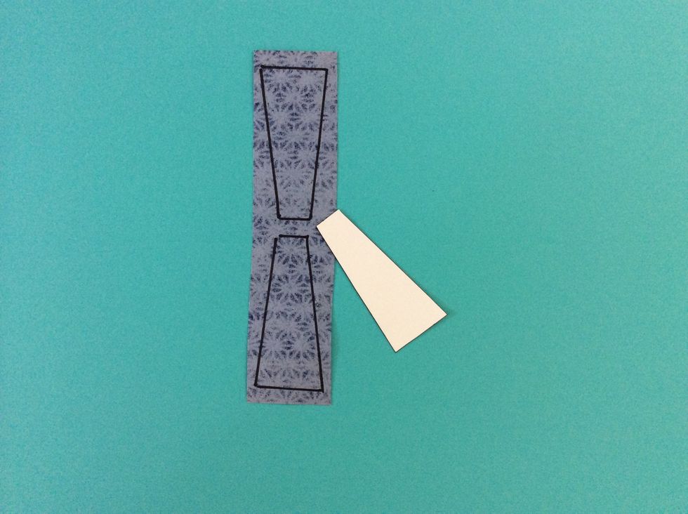 Draw a scarf shape on white poster board, and trace on patterned paper.