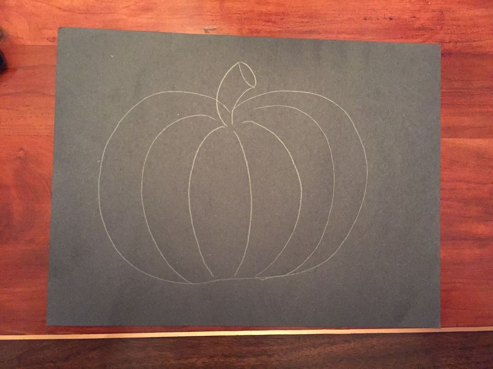 Draw a second curved line on the other side of the oval creating a stem.