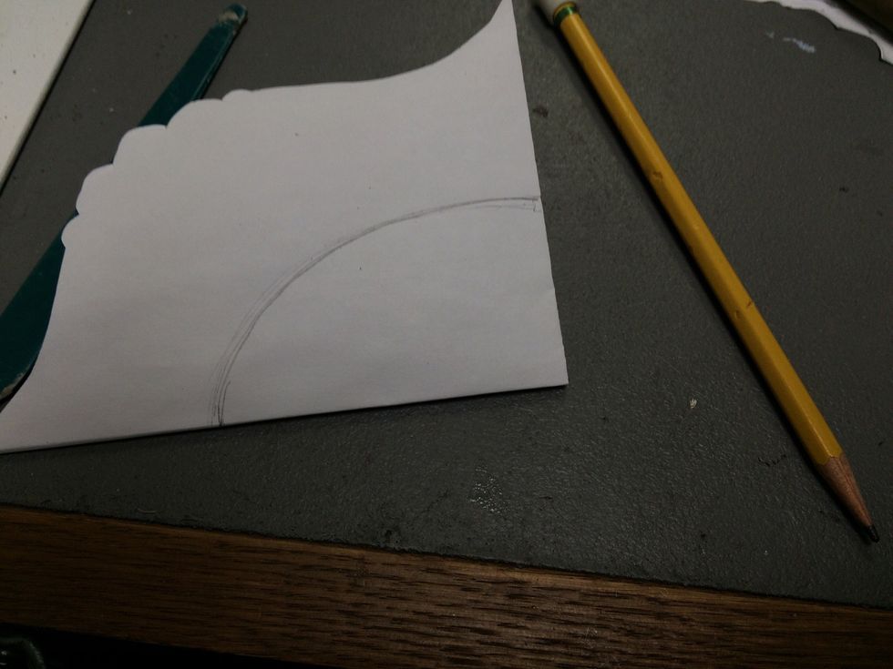 Draw a shape for the center of the loom. Circles and Ovals work best for the line design.